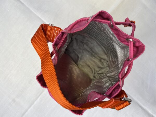 Prada red pink bucket bag inside